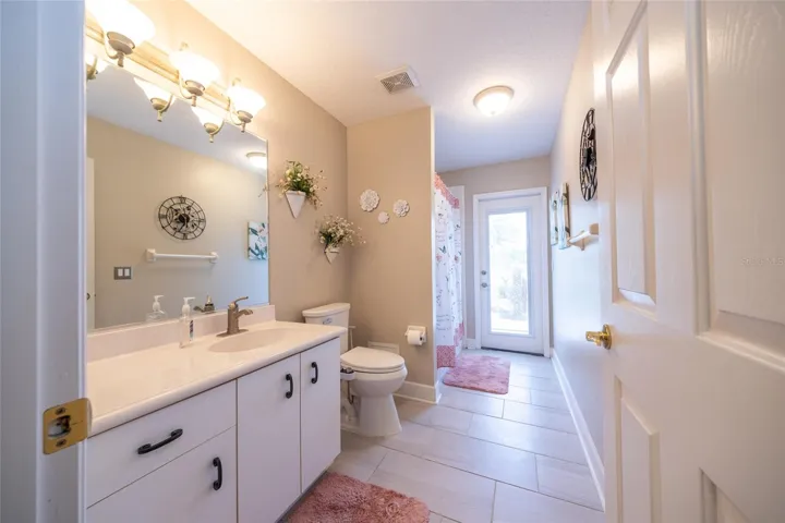 Guest bathroom door to 15 x 30 screened patio