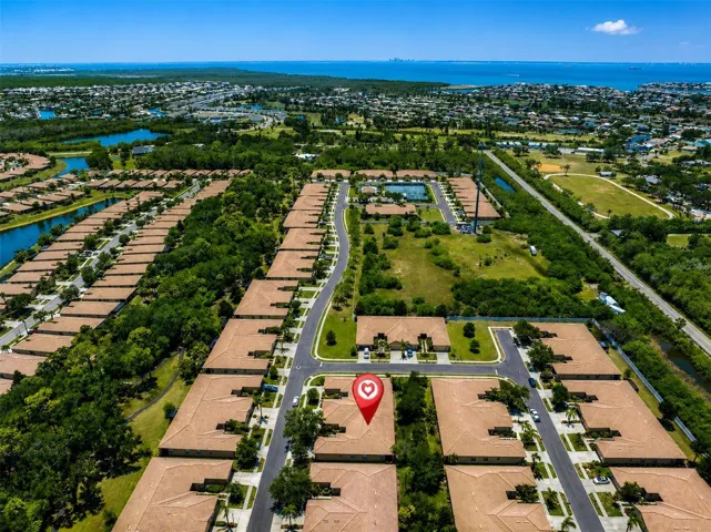 Coastal suburban neighborhood with heart marking location of Villa in Community. and proxmity to water.