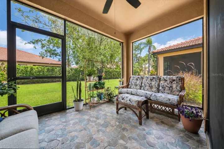 Screened lanai with new rock tile flooring. Lower windows installed on screens.