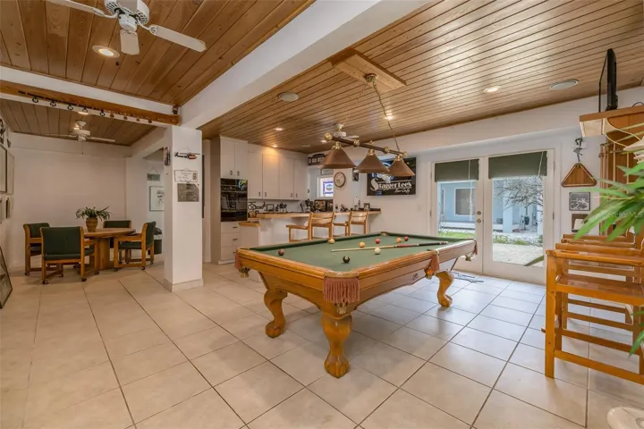 Gameroom has billard & poker table & gorgeous wood ceilings!