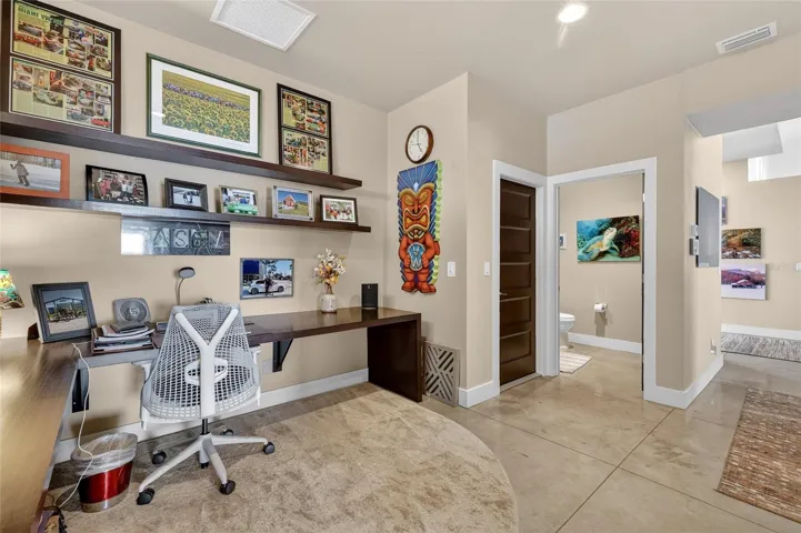 Office Area with Door to Garage and 1/2 Bath