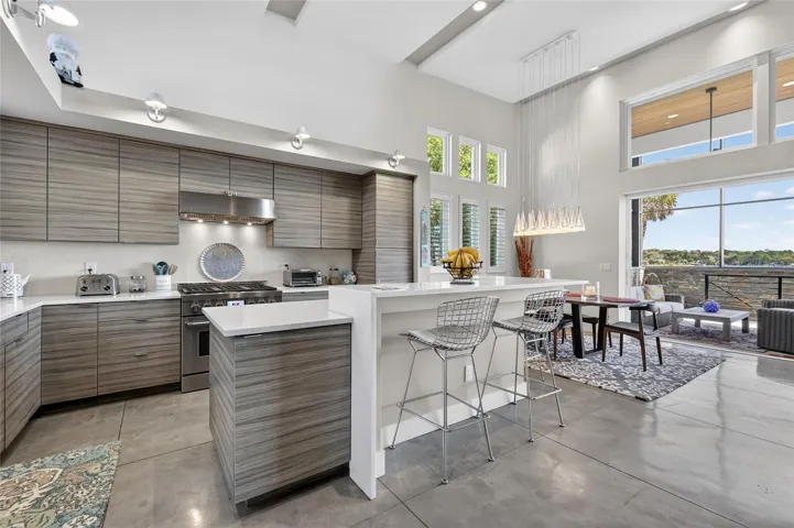 Quartz Counters, SS Appliances, Range Hood, and Breakfast Bar