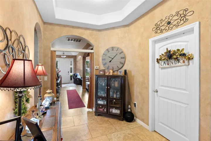 hallway connecting living room/dining area to kitchen/family room