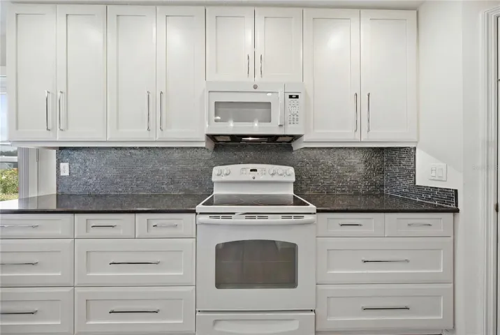 updated kitchen cabinets with Quartz countertops