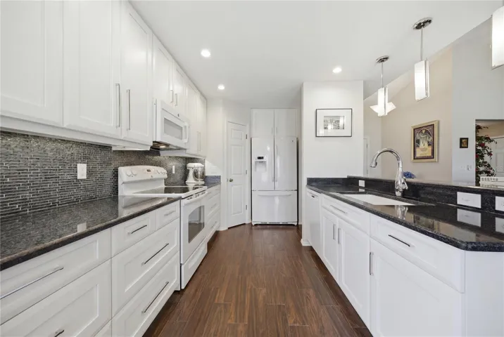 updated kitchen cabinets with Quartz countertops