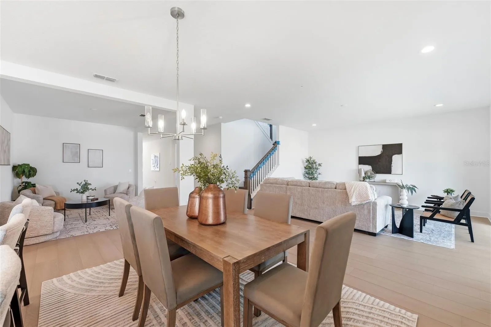 Open concept living with dining room in the center