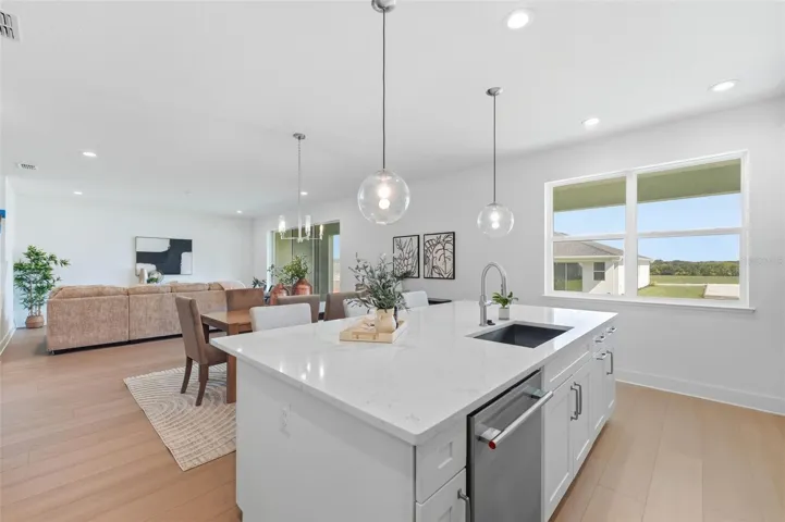Kitchen overlooking dining room and great room