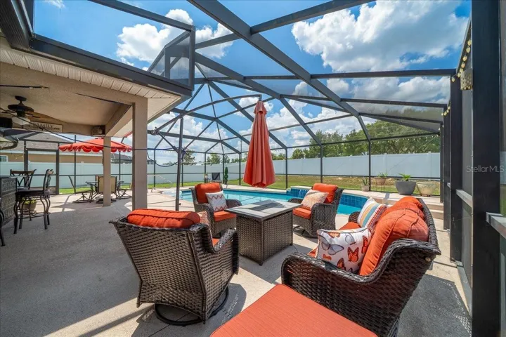 Huge pool deck for entertaining. The pool featurs a waterfall and solar heating