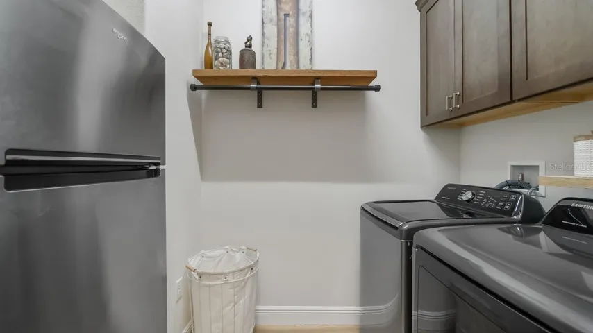 Laundry Room with Cabinetry and 2nd Refrigerator