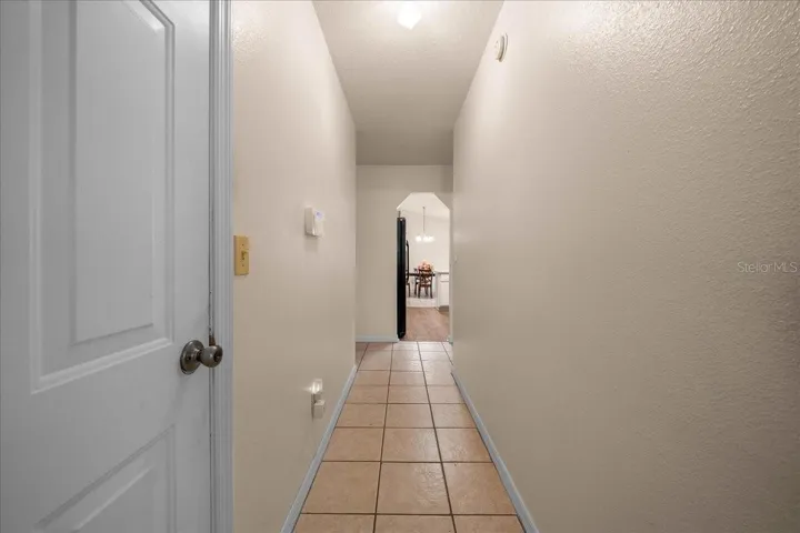 Hallway to 2 additional bedrooms and guest bath