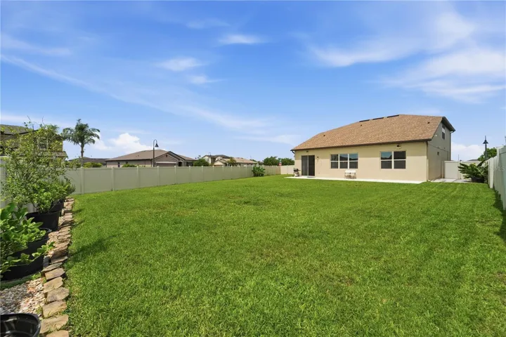 Lots of space in this vinyl fenced yard.