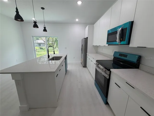 Brand New Kitchen with Quartz Counters and Stainless Appliances