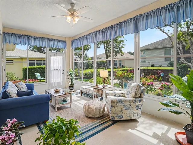 Lanai with view of the beautiful flower garden. Enjoy year round with sliding vinyl windows.
