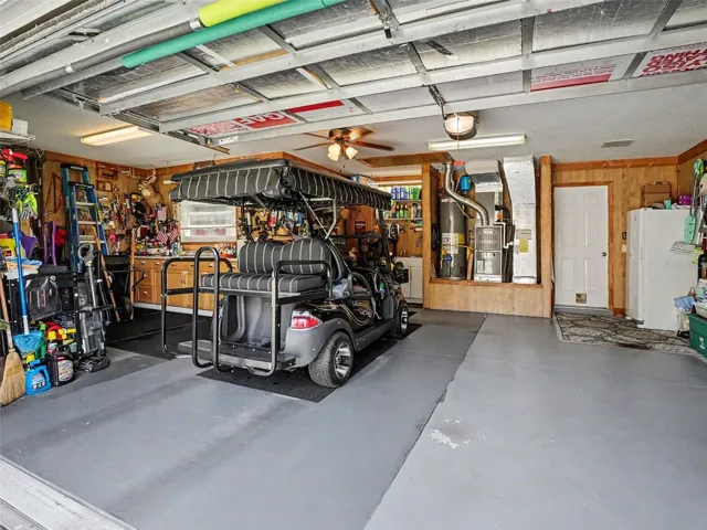 Oversized Garage.  2 car Plus Workshop!!  Includes cabinets, shelving and Golf Cart. Wow!