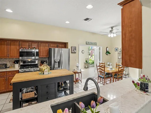 Kitchen with French Doors to front screened courtyard patio.