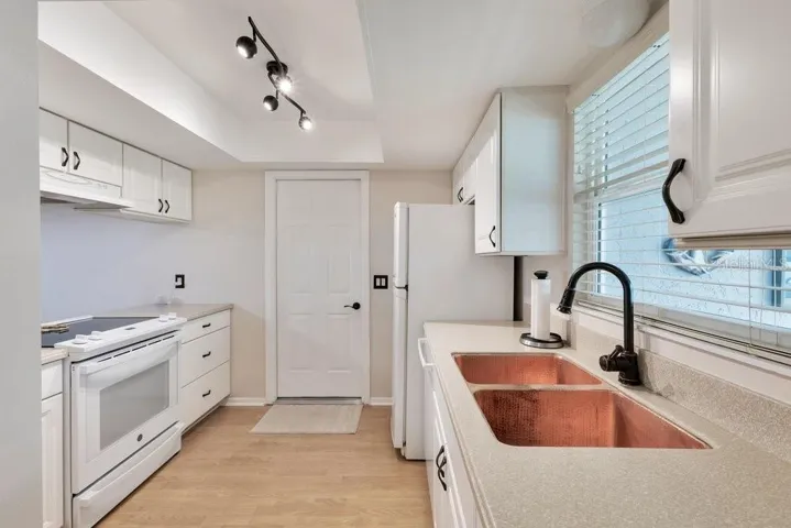 Updated kitchen with handcrafted copper sink.