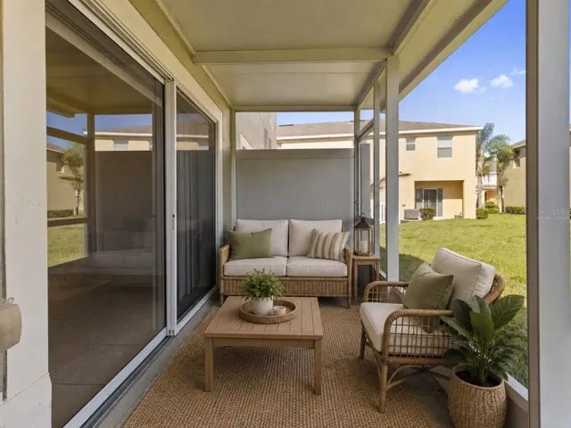 Virtually Staged-Rear Exterior Lanai: Covered & Screened