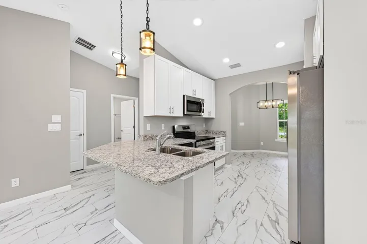 The generous Breakfast Bar offers extra prep space and has room for counter-height seating.