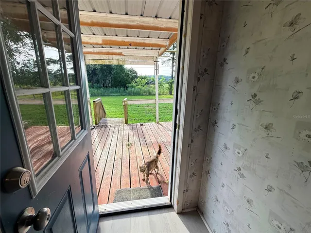 exit to back porch with a pasture private view.