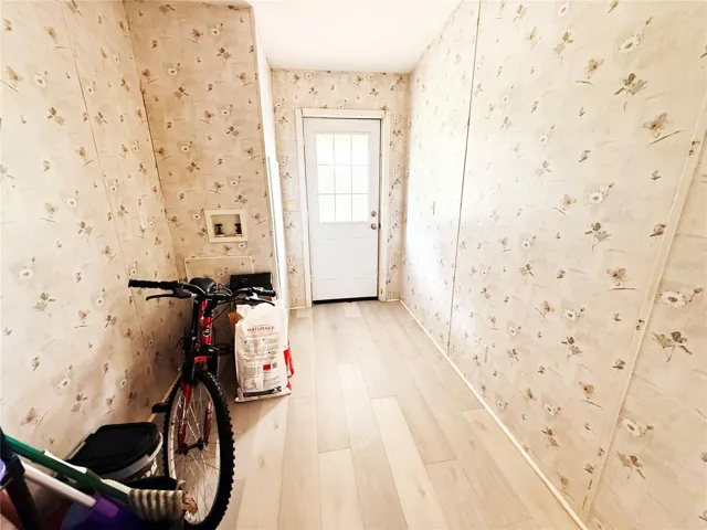 laundry room from kitchen to back porch view