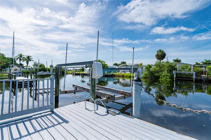 Private dock on Sailboat water canal. Boat lift