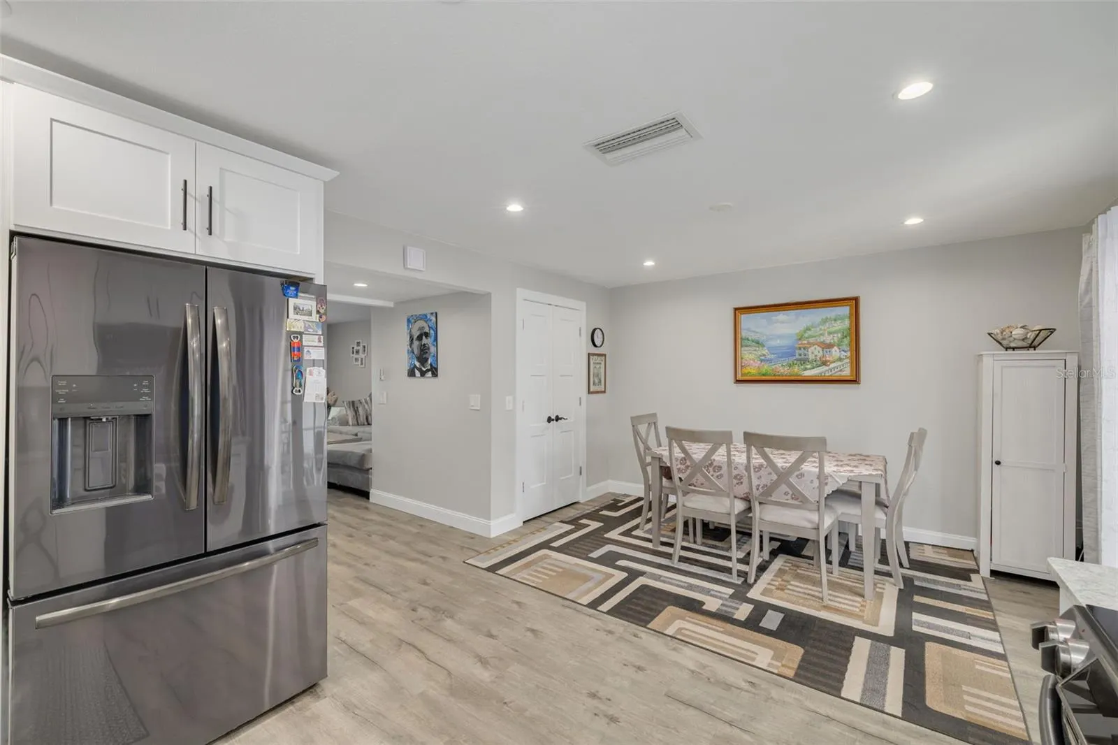 Enter the walk-in panty/utility room just off the dining space, through the double doors.