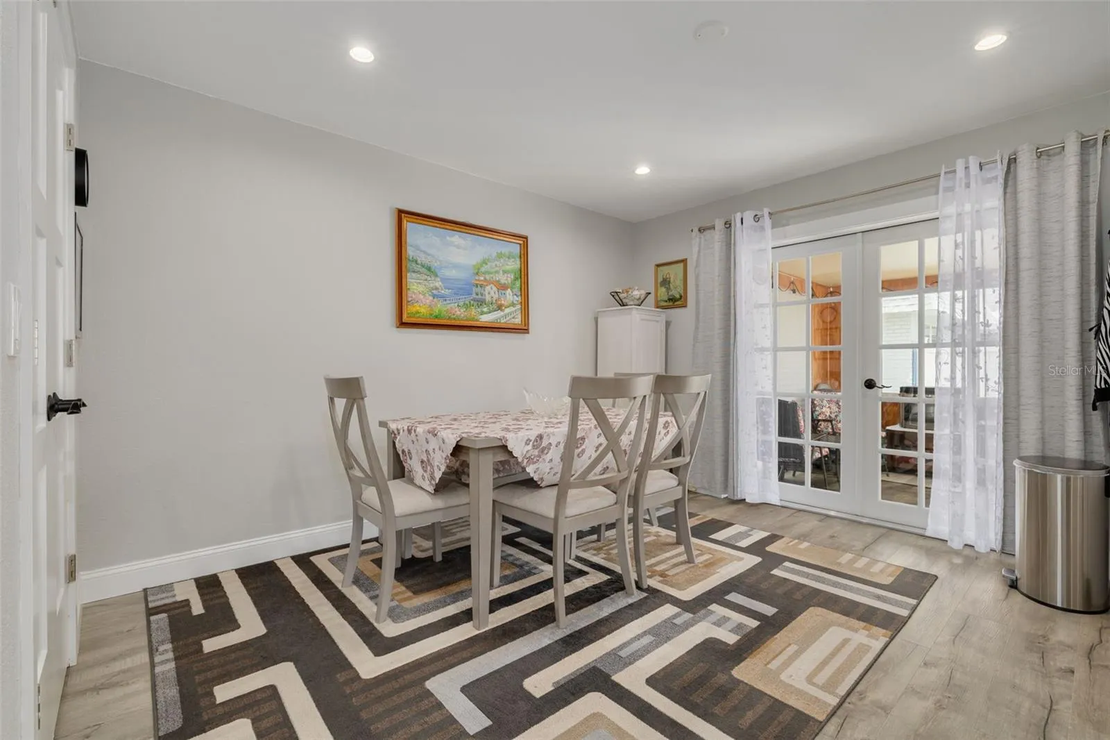Beautiful upgraded French doors lead to the cozy Florida Room!