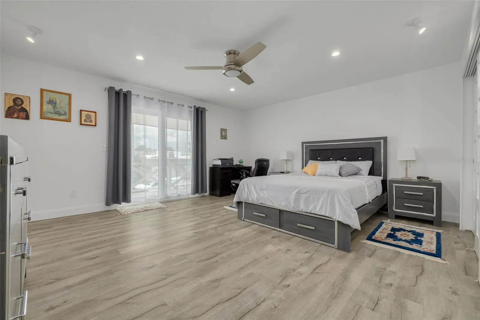 Oversized primary bedroom wtih dual closets and balcony fit for Juliet!