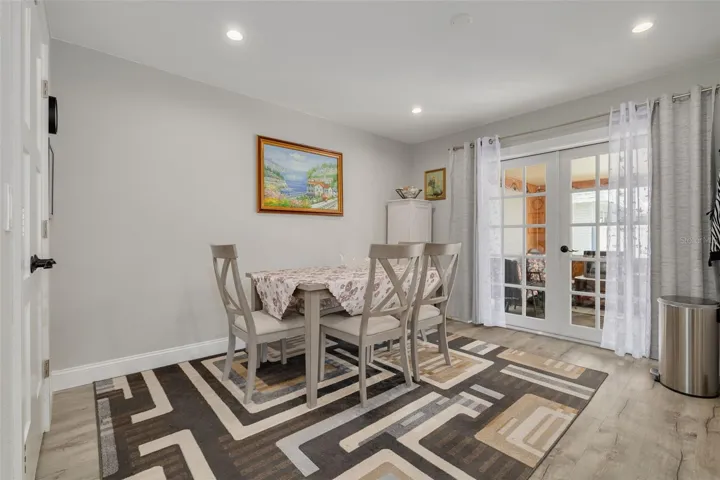 Beautiful upgraded French doors lead to the cozy Florida Room!