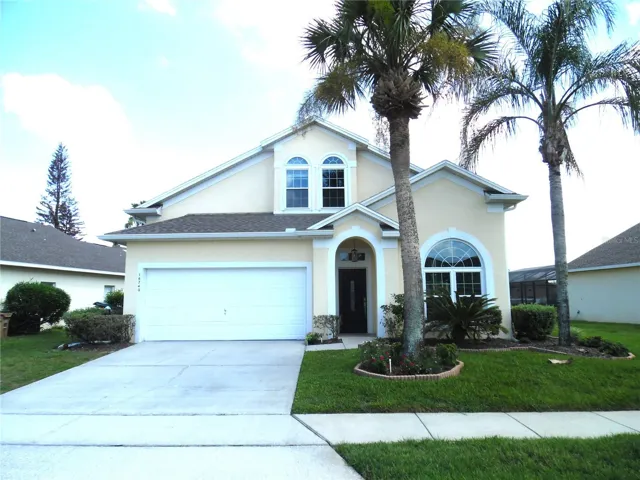 Exterior Front with mature palm trees