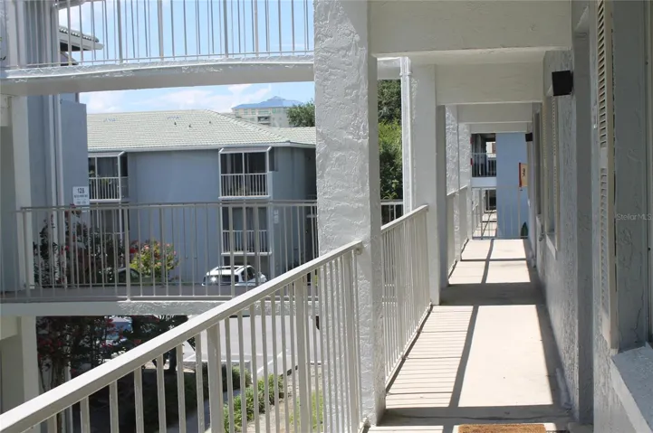 Covered walk way stairs to unit