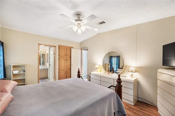 Primary bedroom with built-ins and en suite bathroom