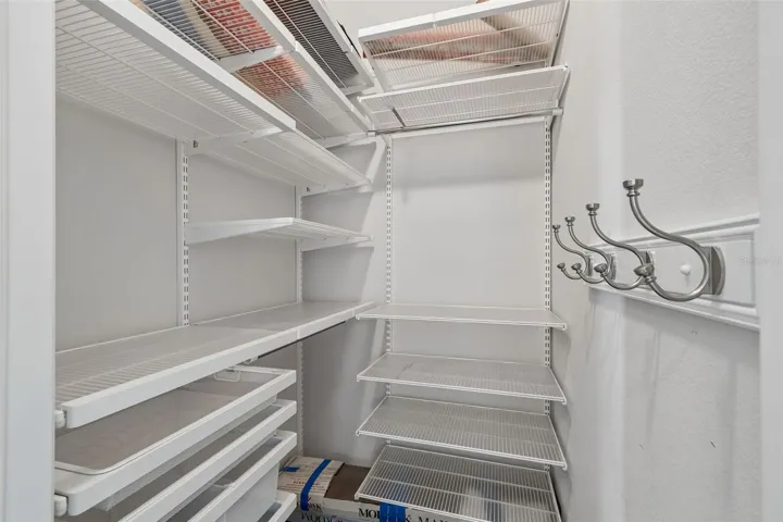 Guest room 1 walk-in closet with closet system