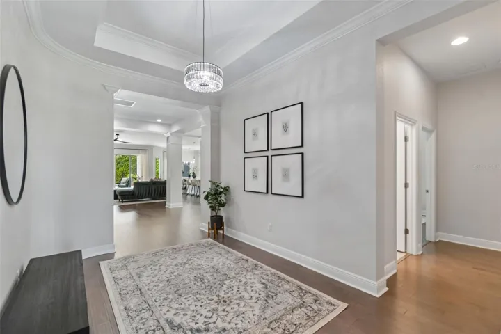 Foyer with hallway to guest full bath & two guest rooms