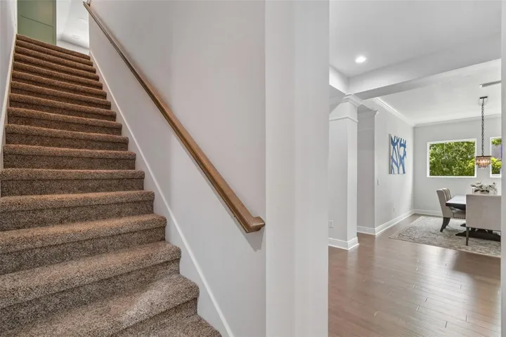 Stairs to bonus room & half bath