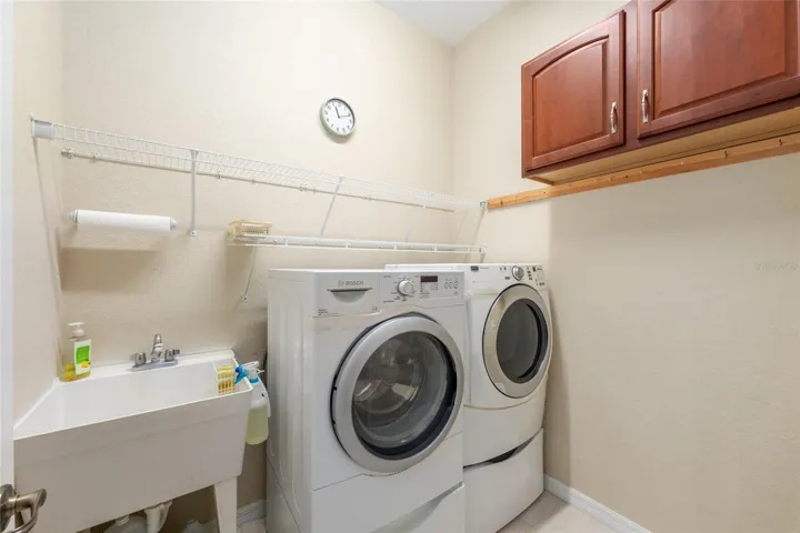 Indoor Laundry room with wash sink