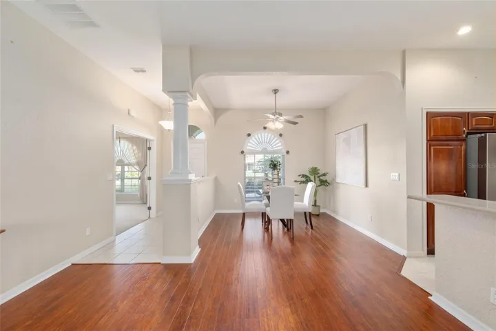 Facing the front door in the family room looking into the dining room
