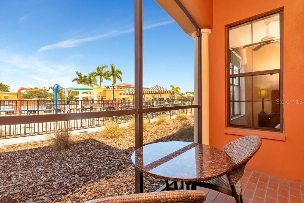 Screened patio overlooking pool area