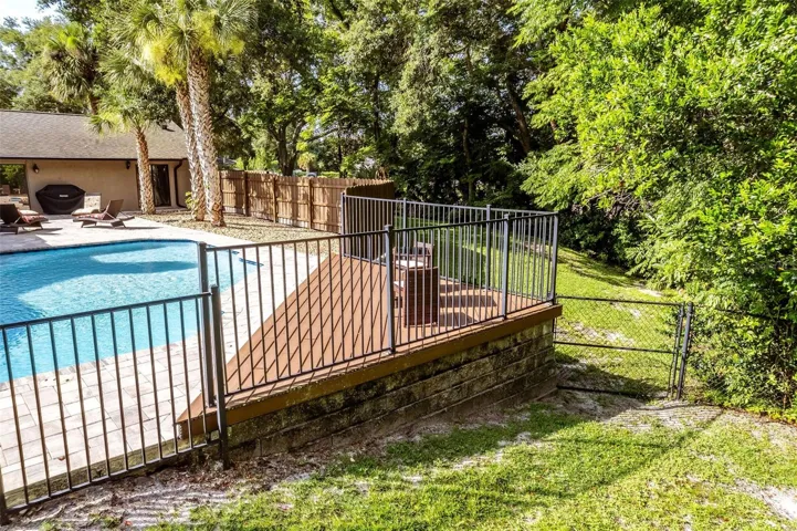 Fenced in pool and patio deck