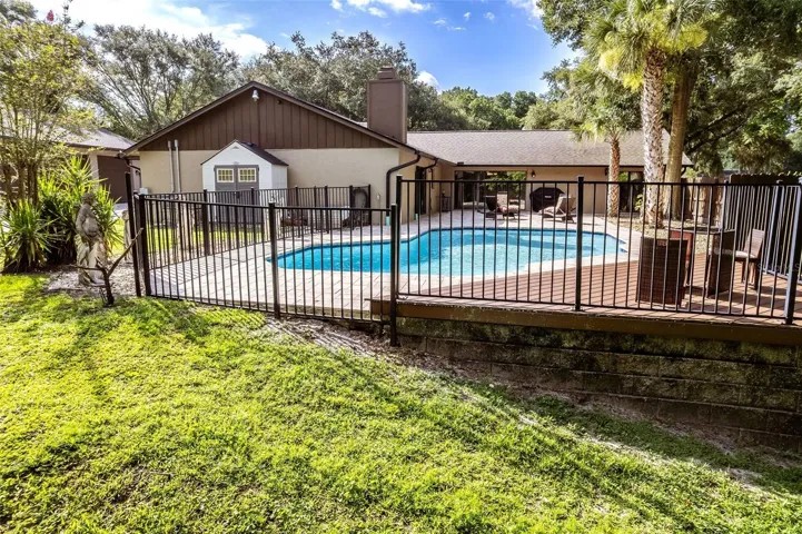 Fenced in pool and patio deck