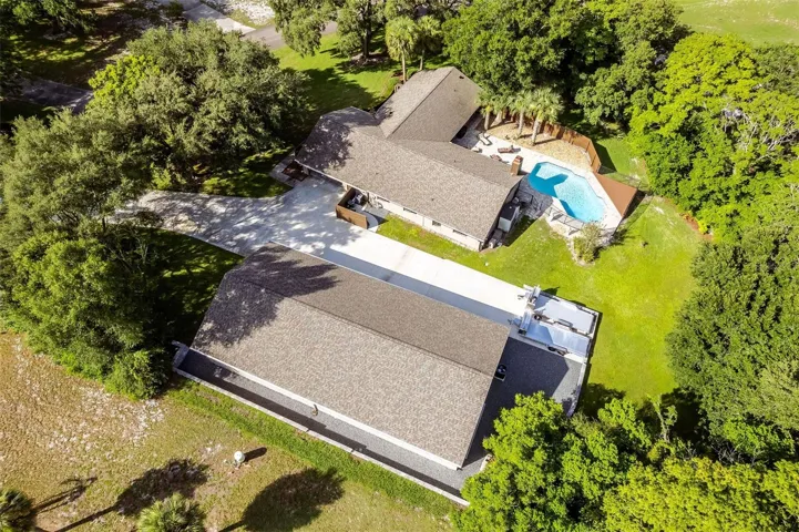 5/3 with 2 car attached garage, pool, and 16 car air conditioned garage
