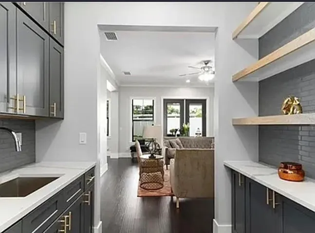 Wet Bar joining dining room with formal living room