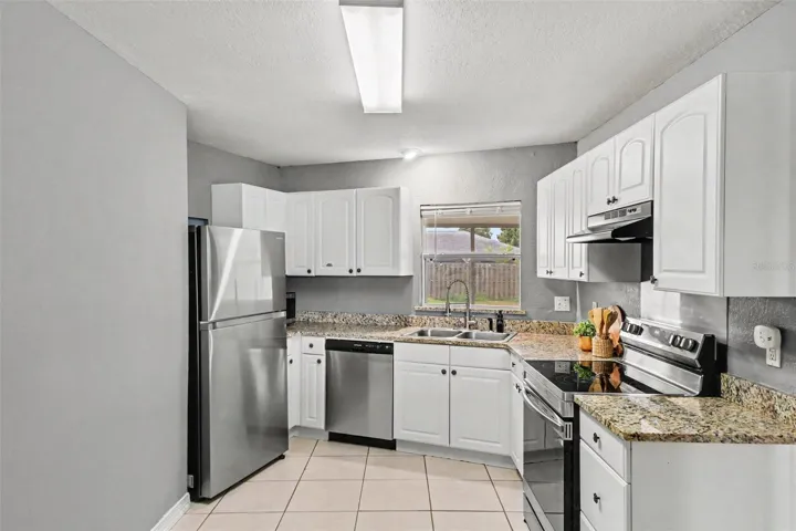 Granite counters and stainless appliances give this kitchen a clean, updated feel.