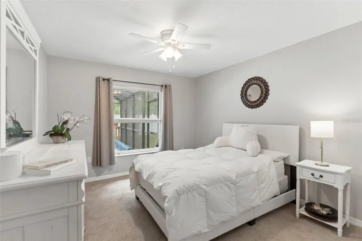 Bedroom 2 with view of the pool