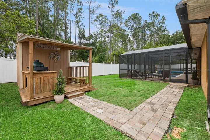 Outdoor BBQ gazeebo and storage with Green Egg and Gas cooktop!