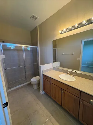Large Master Bathroom. Hard wood cabinets,