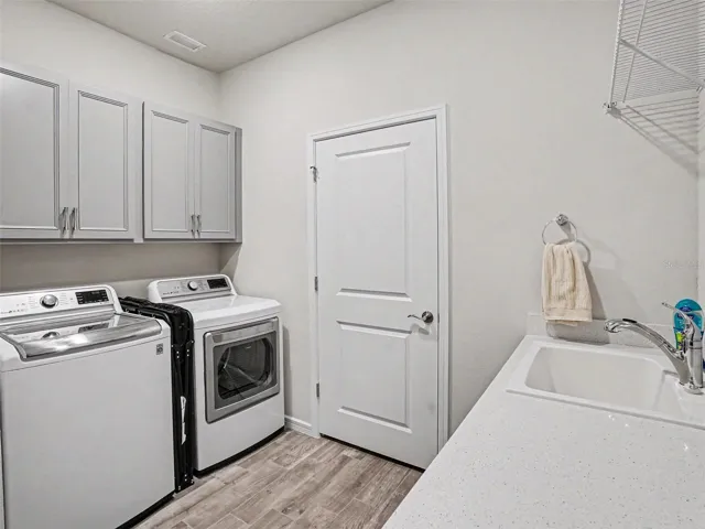 Upgraded Laundry Room with Extra Storage Room
