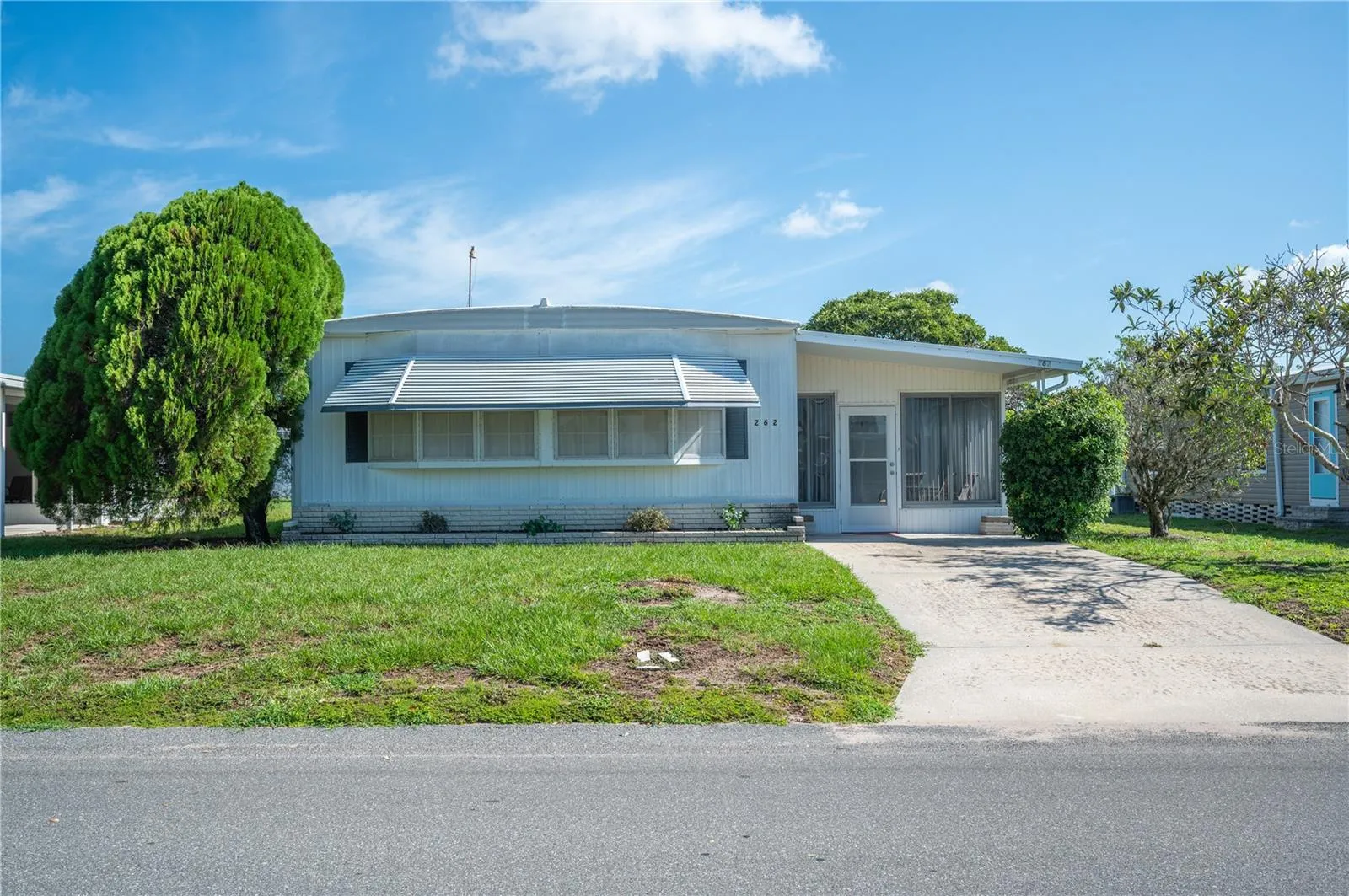Lot 262- across from the clubhouse and pool!