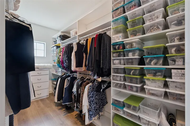 Owner's suite custom closet for all of your clothes, bags, shoes, and needs!