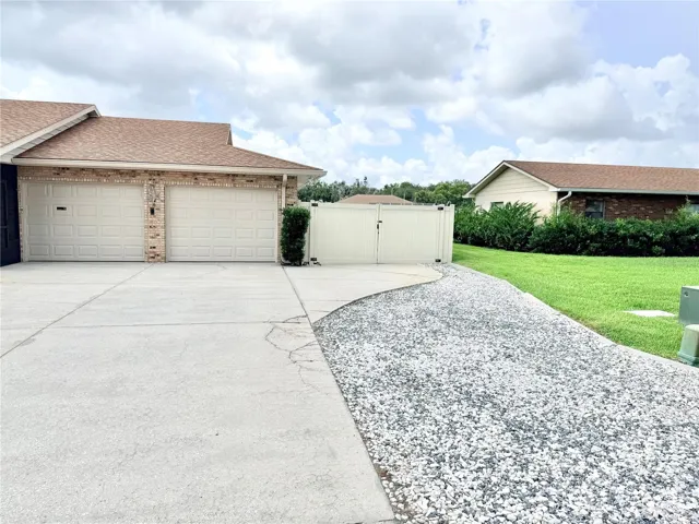 Two car garage and side yard double gate